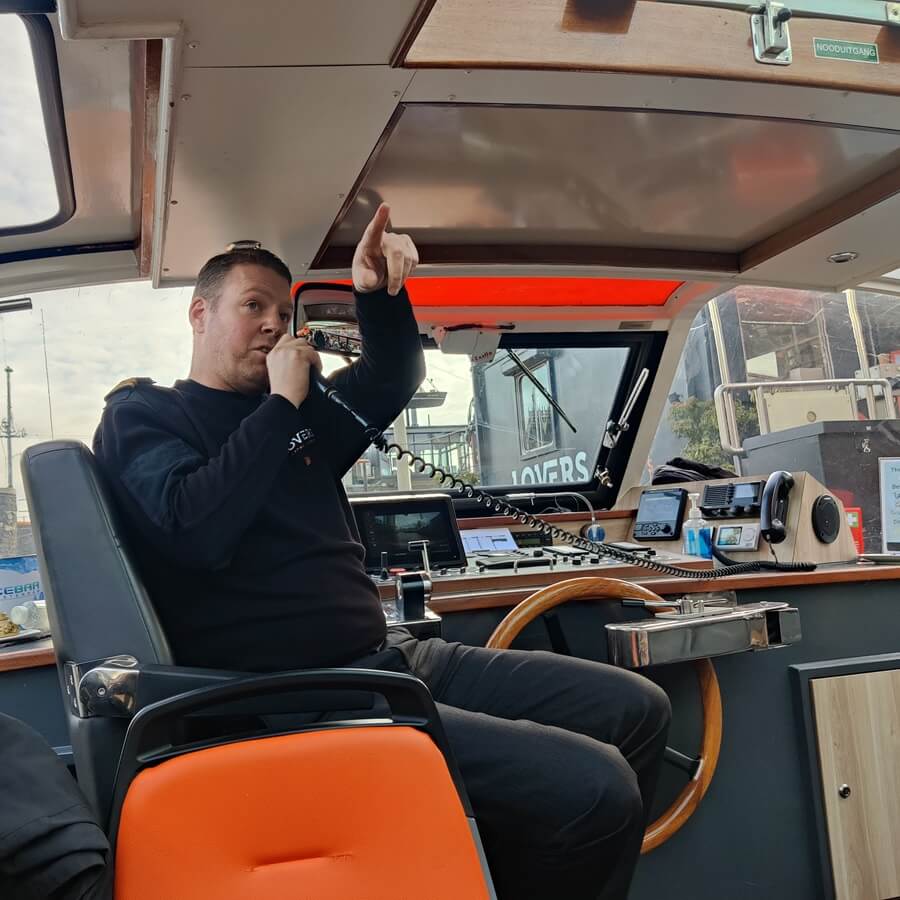 Captain welcoming passengers aboard