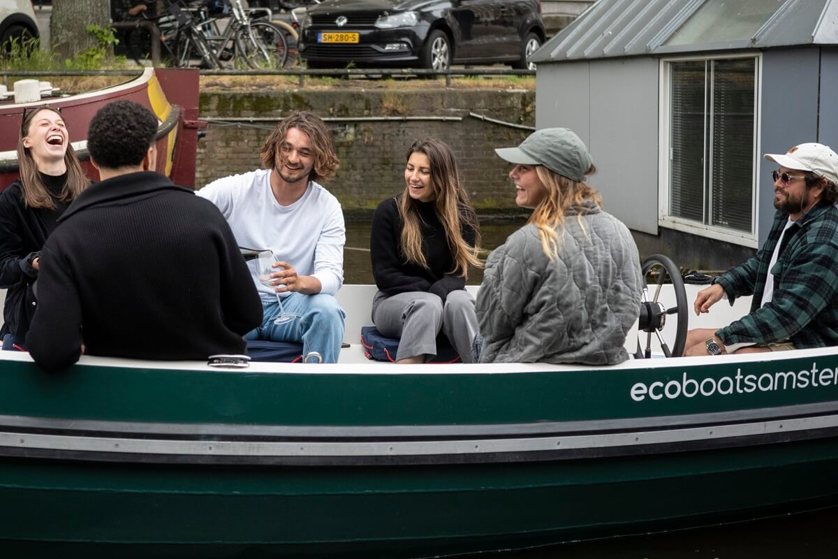 Eco Boats - boat rental - 3 Eco Boats - boat rental - 3 - group having a laugh and a drink on the boat