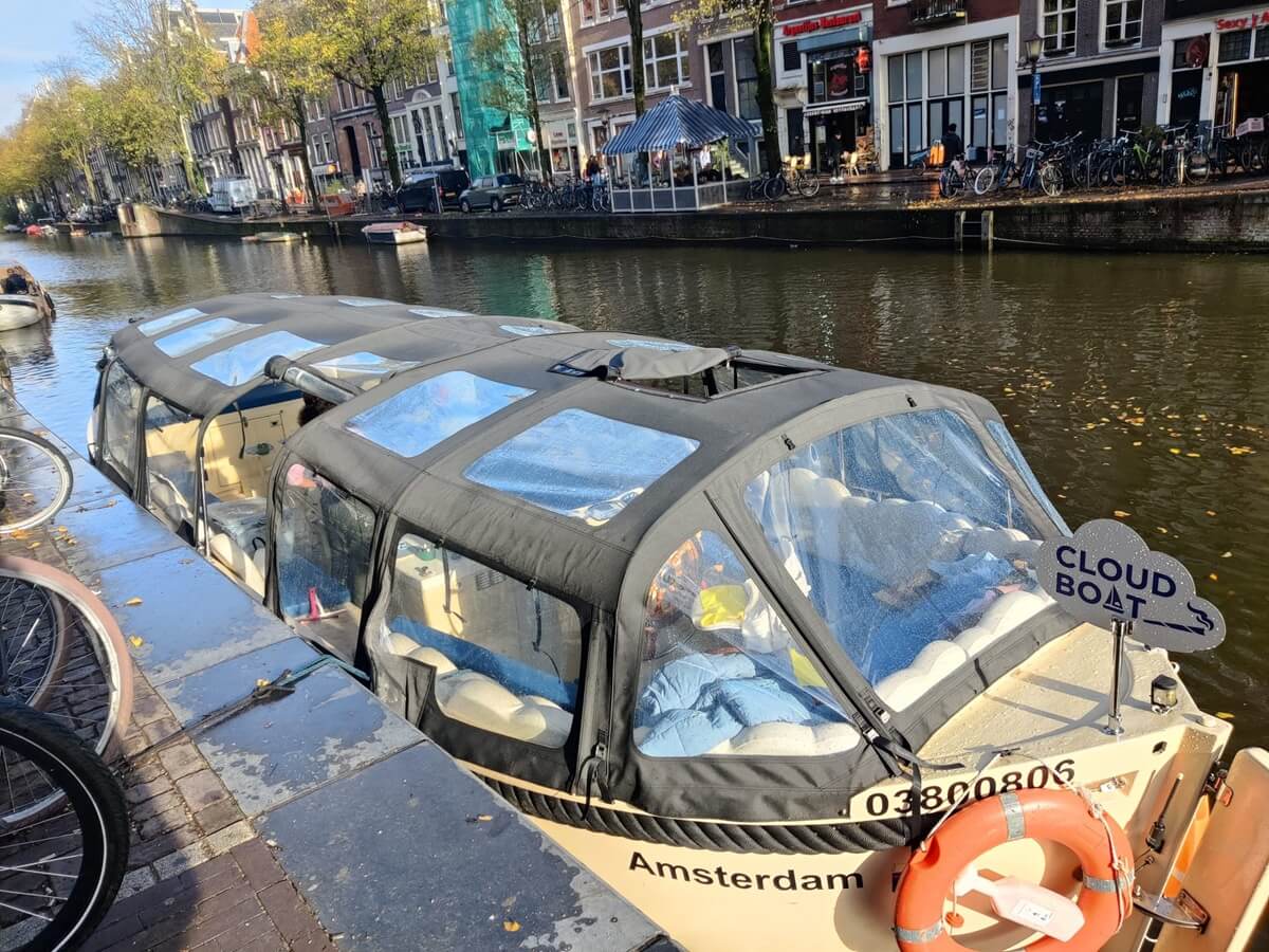 Moored Cloud Boat with cover against the rain