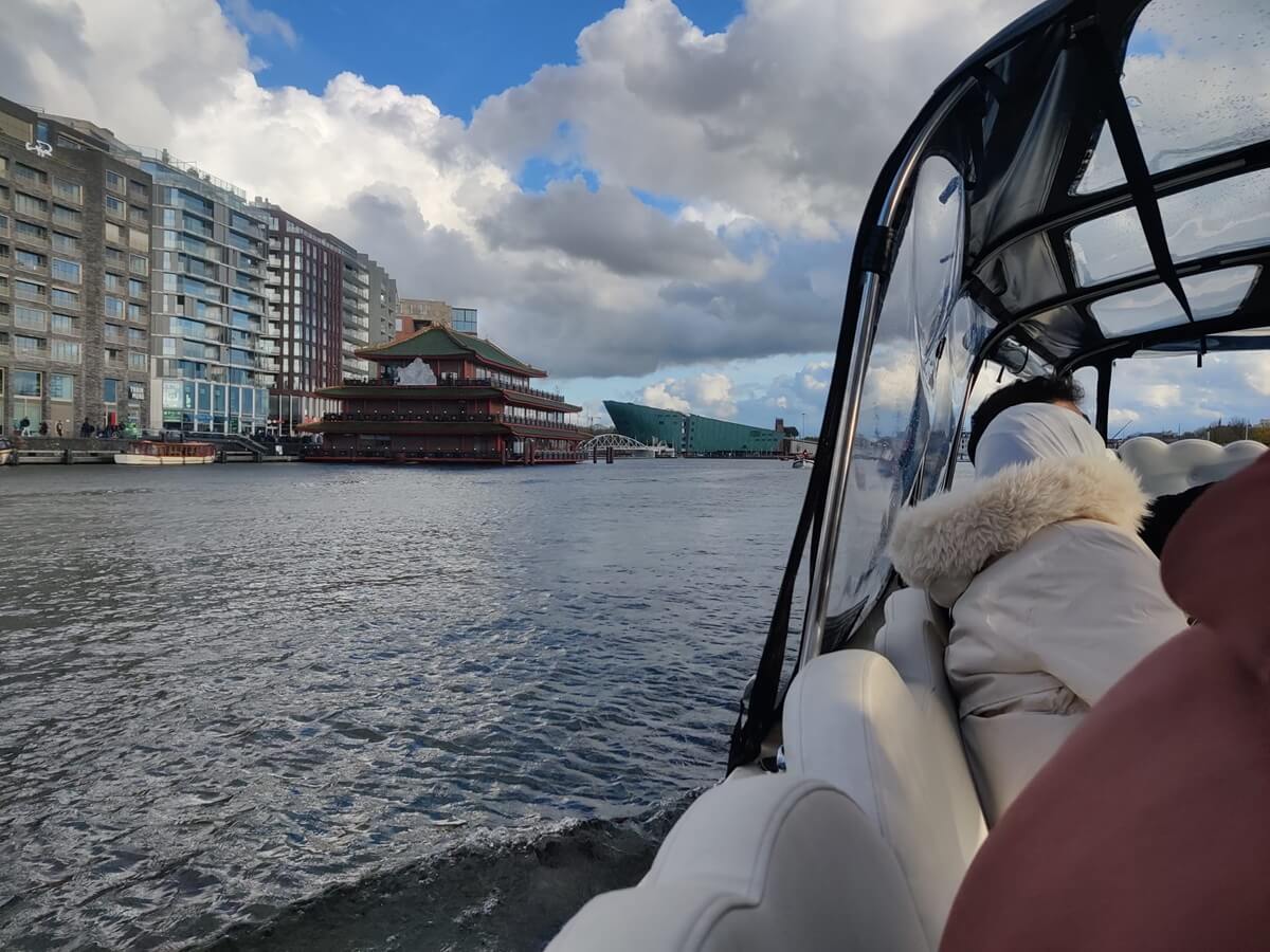 Passing by floating restaurant sea palace and nemo science museum in the Cloud Boat