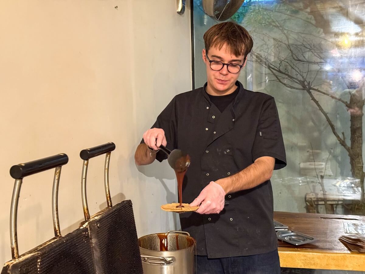 Demonstrating stroopwafel making Demonstrating stroopwafel making