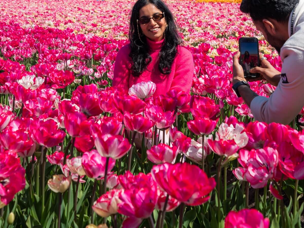 Lady posing in flower fields - Tulip Experience Amsterdam