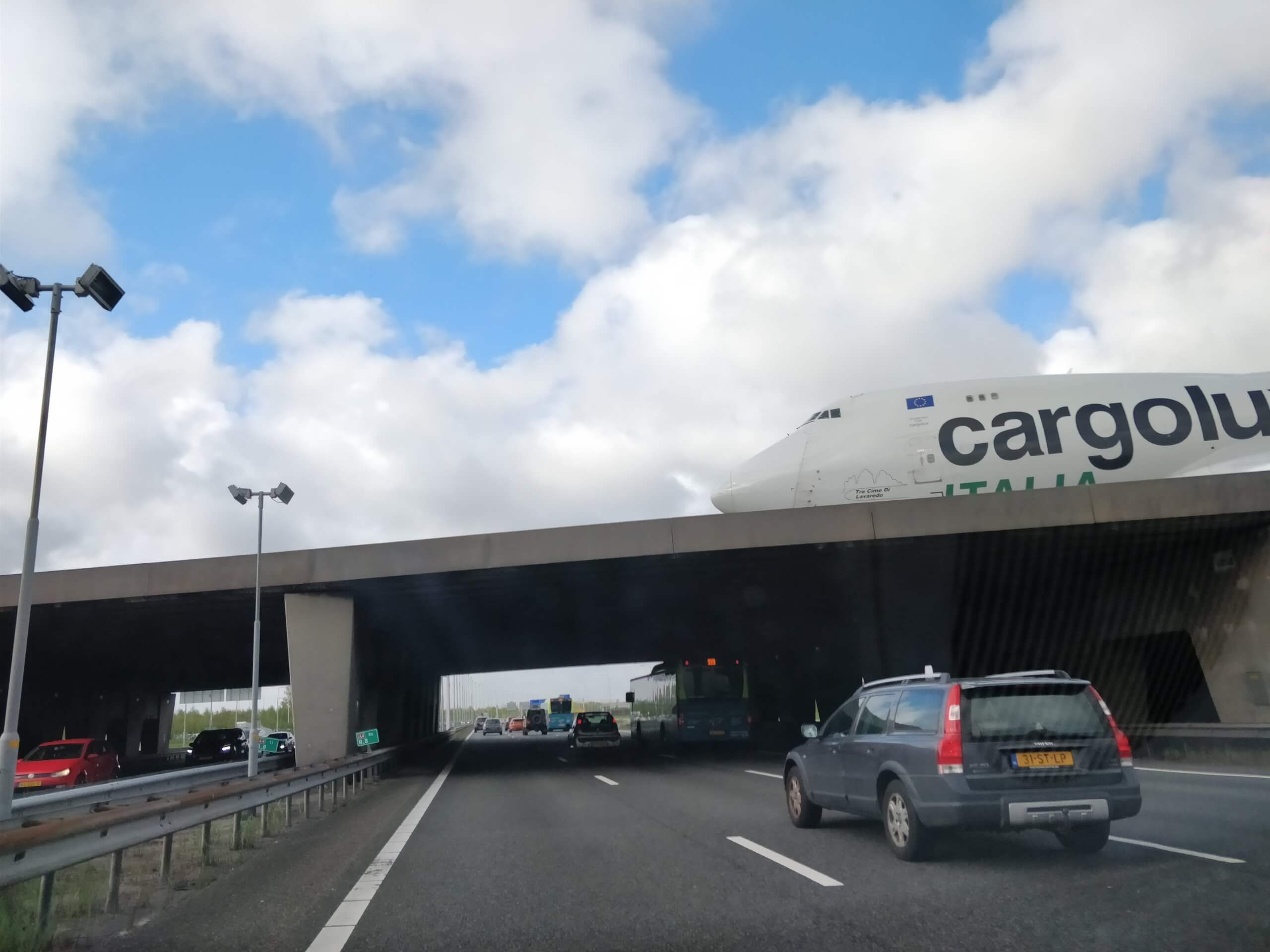 Airplane crossing highway Schiphol Airport