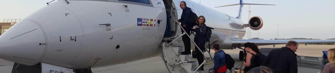 Boarding airplane small airport